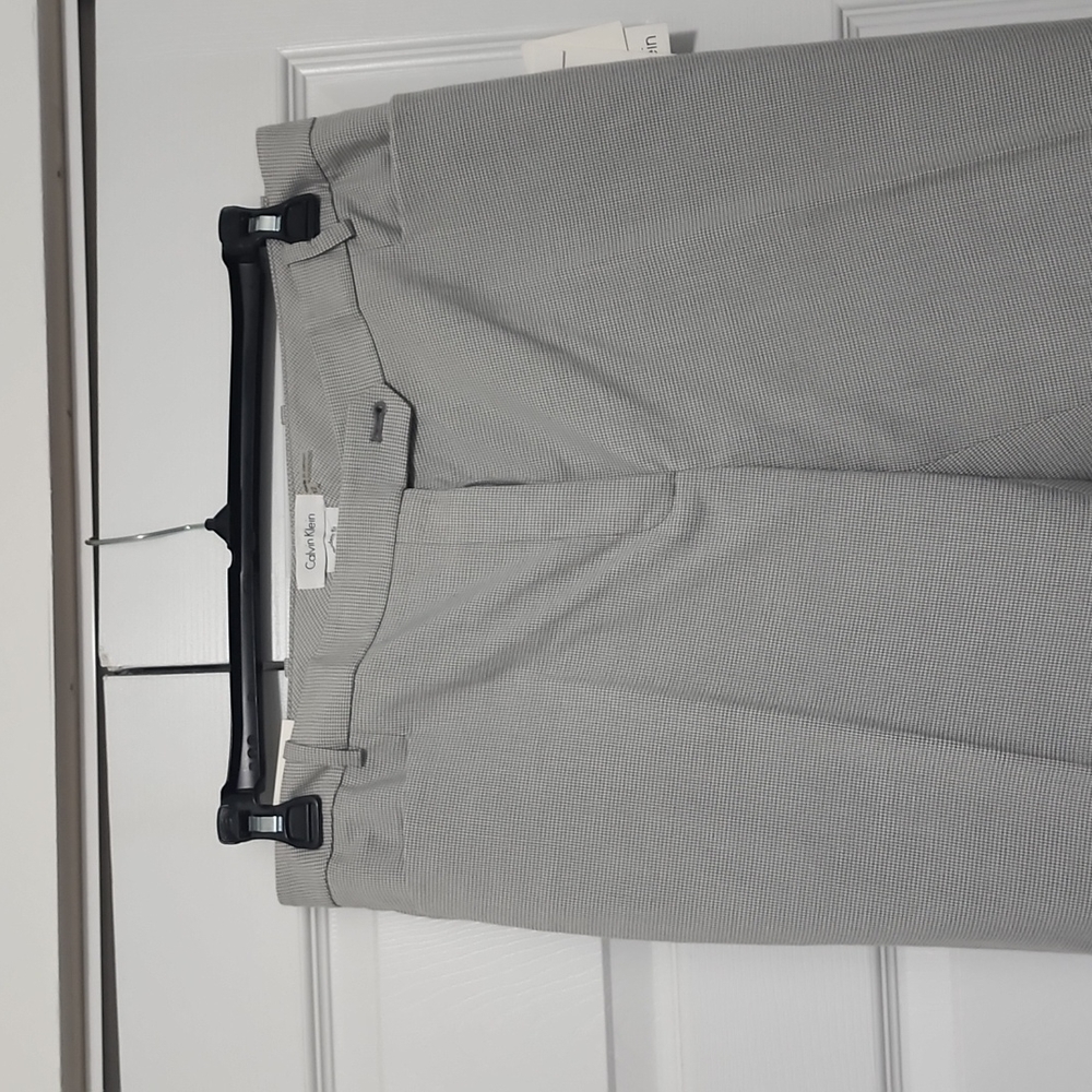 Still tagged - Calvin Klein size 12 suit pants.